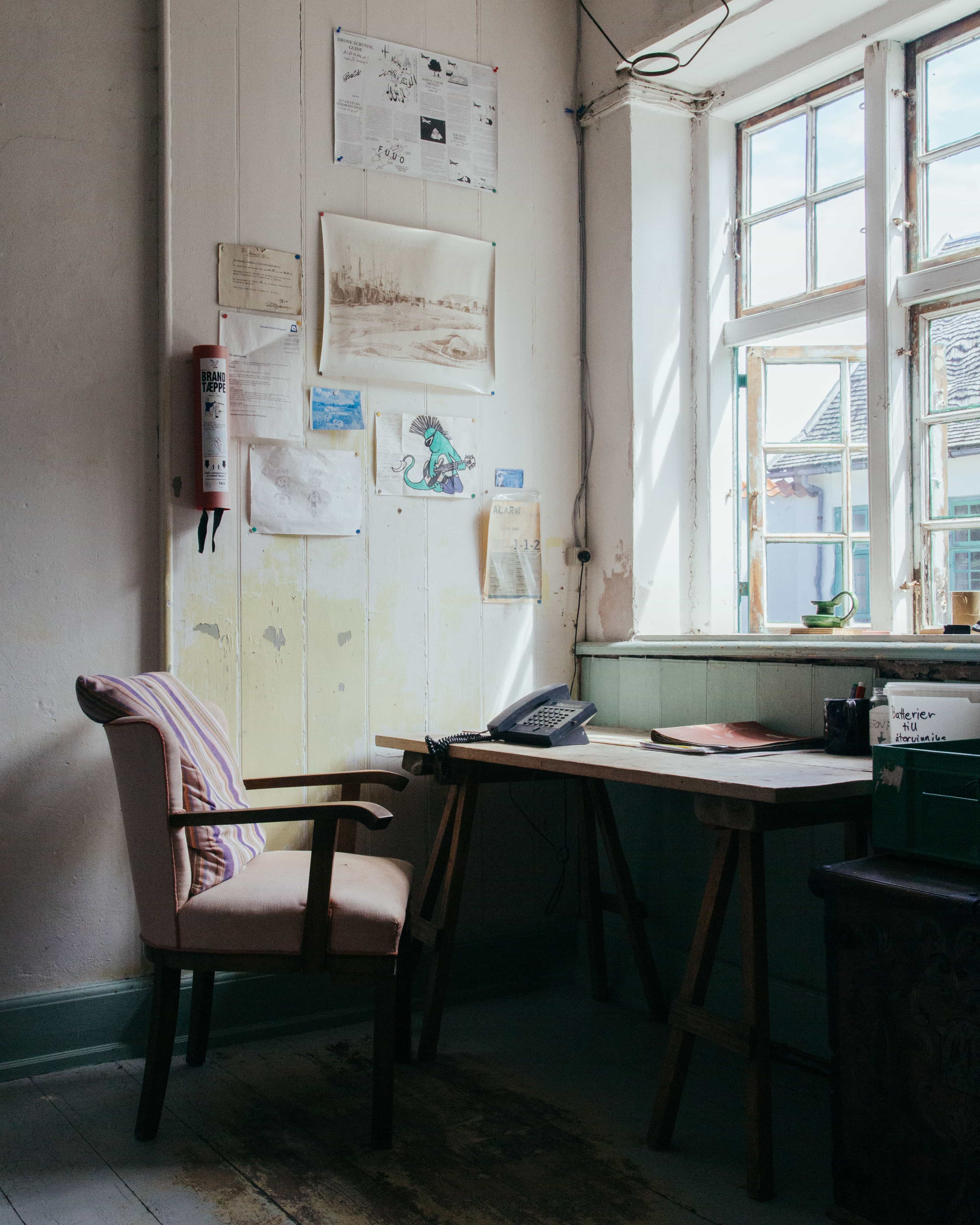 Three men in front of Fyrgaarden.